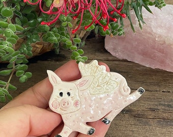 Cute flying Pig ceramic Brooch, handmade clay brooch by Lindy LONGHURST