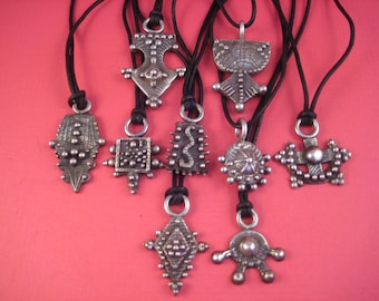 One of kind Cuttlefish castings sterling on leather cord