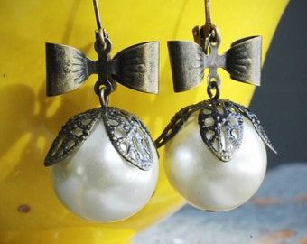 pearly buds and bows earrings. vintage faux pearls and brass sweetheart bows on leverbacks by val b.