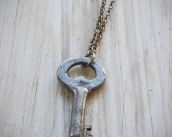 simple little secret necklace. small vintage cabinet key on oxidized sterling silver by val b.