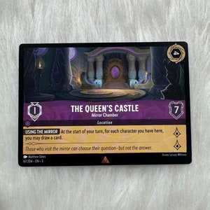 May include: A purple and gold card with an illustration of a castle interior. The card is from the Disney Lorcana trading card game and features the text "The Queen's Castle" and "Mirror Chamber". The card has a number "7" in the top right corner and a number "1" in the bottom left corner.
