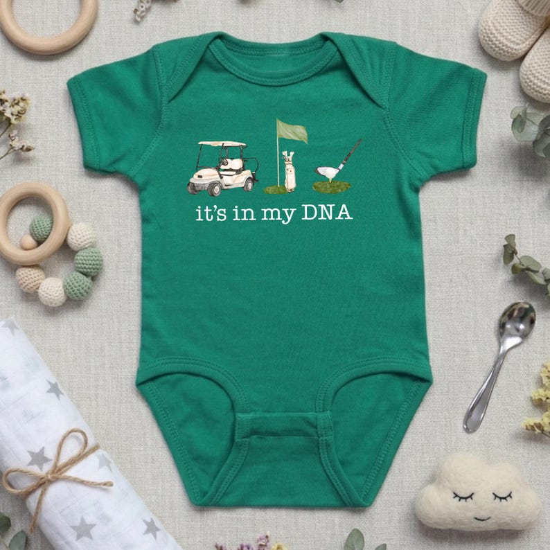 May include: A white ceramic mug with a black handle and the text "But First, Coffee" in a black, handwritten-style font. The mug is on a white surface.