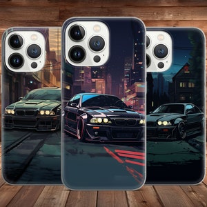 May include: Three clear phone cases with a black background and a city skyline at night. Each case features a different black car with white headlights.
