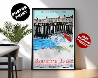 May include: A framed poster print featuring a surfing scene at Sebastian Inlet, Florida. The artwork depicts a red surfboard riding a wave, with a pier and figures in the background. Text includes "World's Best Surf Spots" and "Sebastian Inlet".