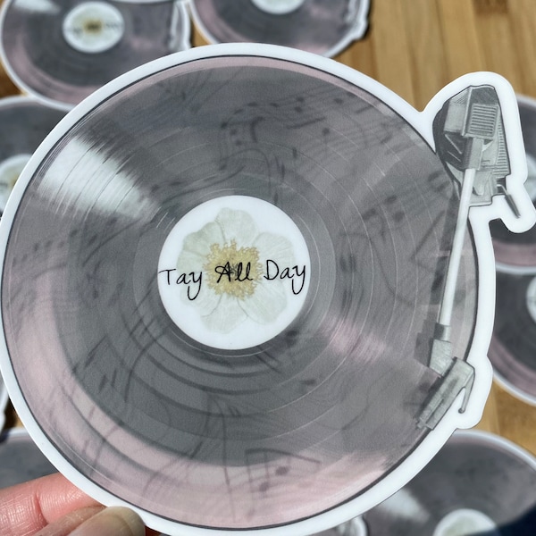 Taylor Swift Gray and Pink Vinyl Record with Musical Notation a White Flower and “Tay All Day” Wording Weatherproof 4in. Vinyl Sticker