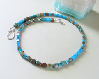 May include: A turquoise and brown square and oval bead necklace with a silver clasp.