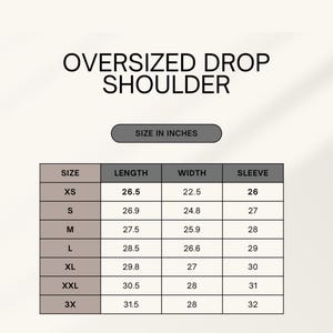 May include: Image of a size chart for an oversized drop shoulder garment. The chart includes measurements in inches for length, width, and sleeve for sizes XS to 3X. The text "SIZE IN INCHES" is above the chart.