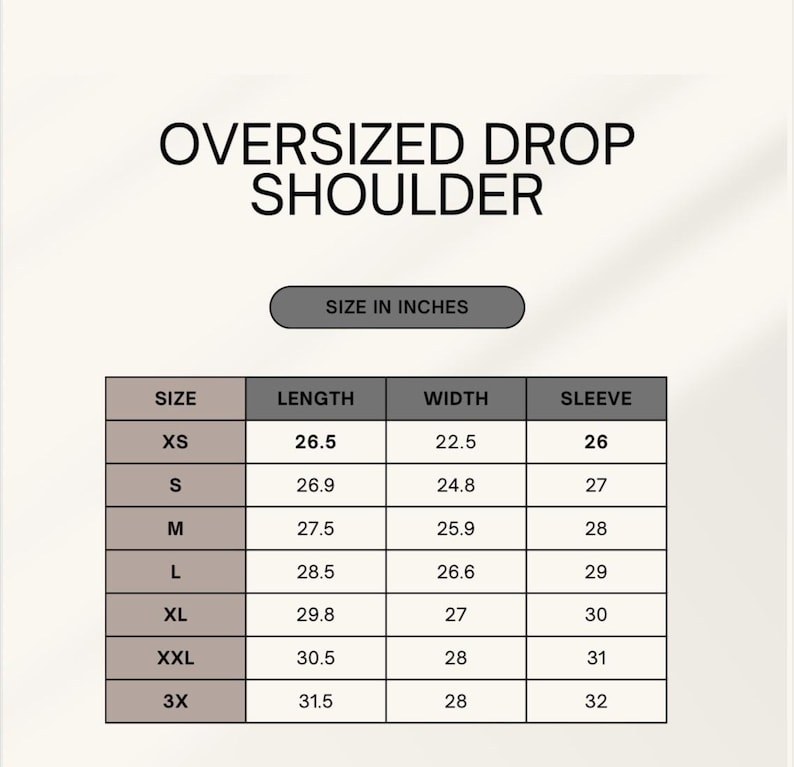 May include: Image of a size chart for an oversized drop shoulder garment. The chart includes measurements in inches for length, width, and sleeve for sizes XS to 3X. The text "SIZE IN INCHES" is above the chart.