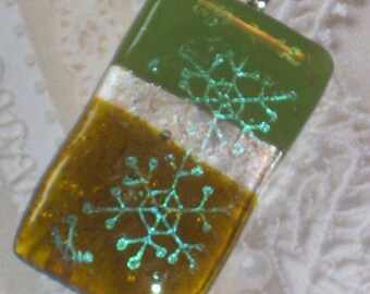 fused dichroic snowflake on green glass pendant