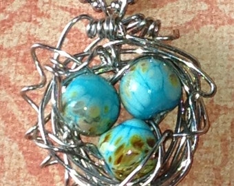 Lampwork bead wirewrapped bird nest pendant necklace