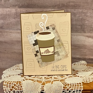 May include: A brown card with a coffee cup illustration and the text "I like big cups and I cannot lie..." printed on it.