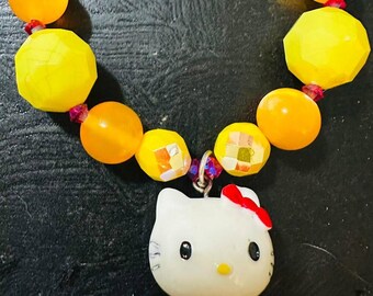 Unique Adorable One Of A Kind Hello Kitty Stretchy Bracelet Vibrant Yellow, Pink and Orange