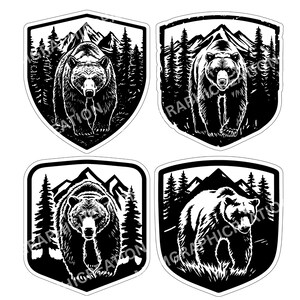 May include: Four black and white bear stickers. Each sticker features a bear in a shield-shaped frame with a mountain and forest background. The bear is the central focus, with detailed fur and facial features.