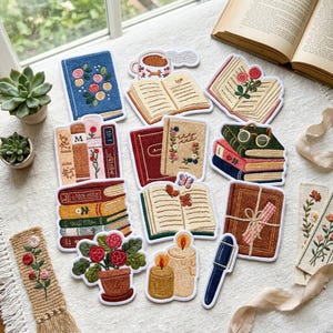 May include: A collection of embroidered patches featuring various book-themed designs, including stacks of books, open books with floral motifs, a potted plant, candles, and a pen, all rendered in vibrant colors on a white fabric background.
