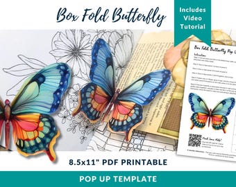 May include: A colorful pop-up butterfly template with blue, orange, and yellow wings. The image includes the text "Box Fold Butterfly" and "8.5x11" PDF Printable". A video tutorial is included. The template is designed for crafting.