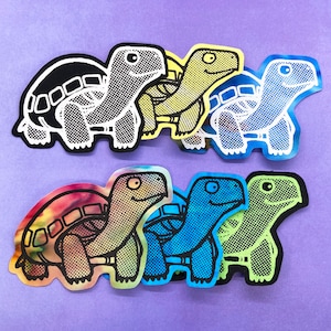 May include: A set of ten colorful turtle stickers. The turtles are all different colors and have different patterns. They are all in a cartoon style and have a friendly expression.