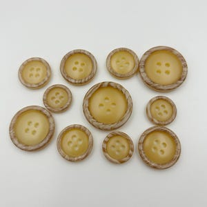 Khaki resin buttons, suitable for clothing accessories, doll decorations, and DIY projects.
