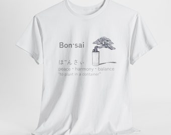 May include: White t-shirt with a black and white illustration of a bonsai tree and the text "Bon'sai" in black. The Japanese word for bonsai is written in black below the illustration, followed by the words "peace, harmony, balance" and "to plant in a container" in black.