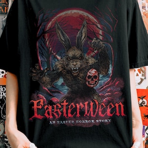 May include: Black t-shirt with a scary rabbit-like figure holding a skull, set against a red moon and forest background. The text "Easterween" is in red gothic lettering, with "An Easter Horror Story" underneath.