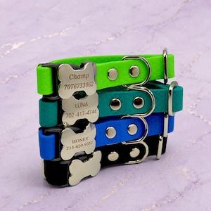 May include: A stack of four silicone pet collars in lime green, teal, blue, and black, each featuring a honeycomb texture, a silver-toned metal buckle, and a bone-shaped identification tag engraved with names and phone numbers like Champ 7076733062.