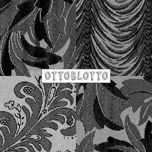May include: Black and white patterned fabric with a floral design. The fabric has a textured surface and a repeating pattern. The text "OTTOBLOTTO" is printed in white on a black rectangle.