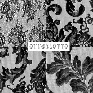 May include: Black and white patterned fabric with a repeating floral design. The fabric has a textured surface and a subtle sheen. The text "OTTOBLOTTO" is printed in white on a black background.