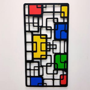 Arte de parede de metal abstrata e colorida: escultura de formas geométricas