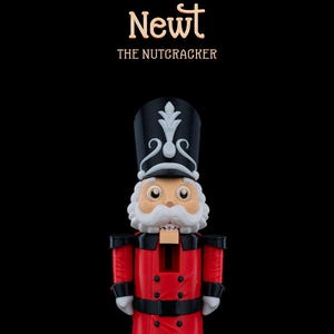 May include: A red and black nutcracker figurine with a white hat and a white mustache. The figurine is standing on a black surface and the text "Newt THE NUTCRACKER" is above the figurine.