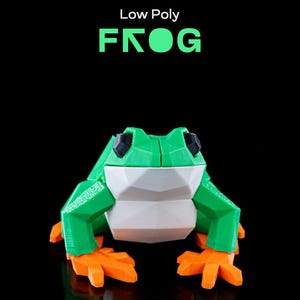 May include: Low Poly Frog is a 3D printed figurine with a green body, white belly, and orange feet. The frog is sitting on a black surface.