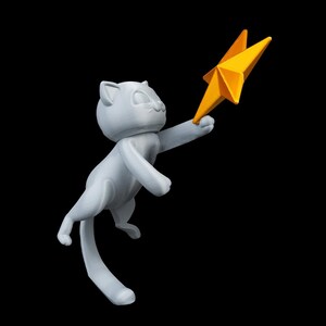 May include: A light gray cat figurine reaching for a bright yellow star. The cat is in a playful pose, with its tail curved and its front paws extended. The star has multiple points and a textured surface, set against a black background.