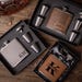 May include: Three gift sets for flasks with personalised engravings. Each set includes a flask, a funnel, and four shot glasses. The flasks are brown leather, grey leather, and brown leather with a black trim. The engravings on the flasks read "Groomman James 10.20.2025", "KM", and "Kevin".