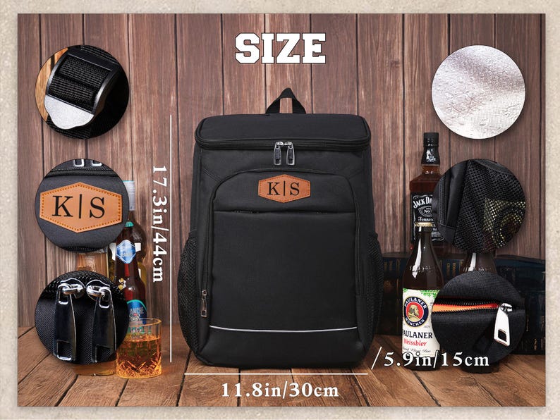 May include: Black insulated backpack with a brown leather patch displaying the initials "K|S". The backpack is 17.3 inches tall, 11.8 inches wide, and 5.9 inches deep. It has a top handle and a front pocket.