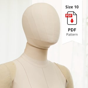 Puede incluir: Un maniquí beige con cabeza y hombros redondeados, diseñado para coser y crear patrones. El maniquí tiene costuras visibles y está marcado con alfileres. Una pancarta blanca muestra "Size 10" y "PDF Pattern".