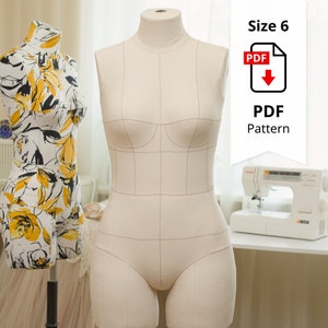 May include: A beige dress form with grid lines, a Size 6 PDF pattern, and a sewing machine. Another dress form is visible on the left, covered in a white fabric with yellow floral patterns. The PDF pattern is indicated by a red PDF icon.