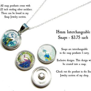 May include: A silver necklace with a 18mm interchangeable snap pendant featuring a peacock design. The pendant is 18mm in diameter and costs $3.75. The text "18mm Interchangeable Snaps - $3.75 each" is visible in the image.