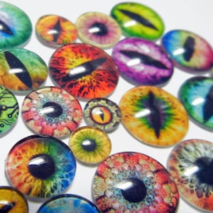 May include: Assortment of colorful glass eyes with various designs, including a circuit board, a rainbow, and a dragon eye. These glass eyes are perfect for crafting projects.