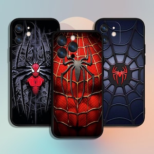 May include: Three different phone cases featuring a Spiderman design. The cases are black with a red and black spider web design. One case has a red Spiderman logo, another has a red and black Spiderman logo, and the third has a blue and black spider web design.