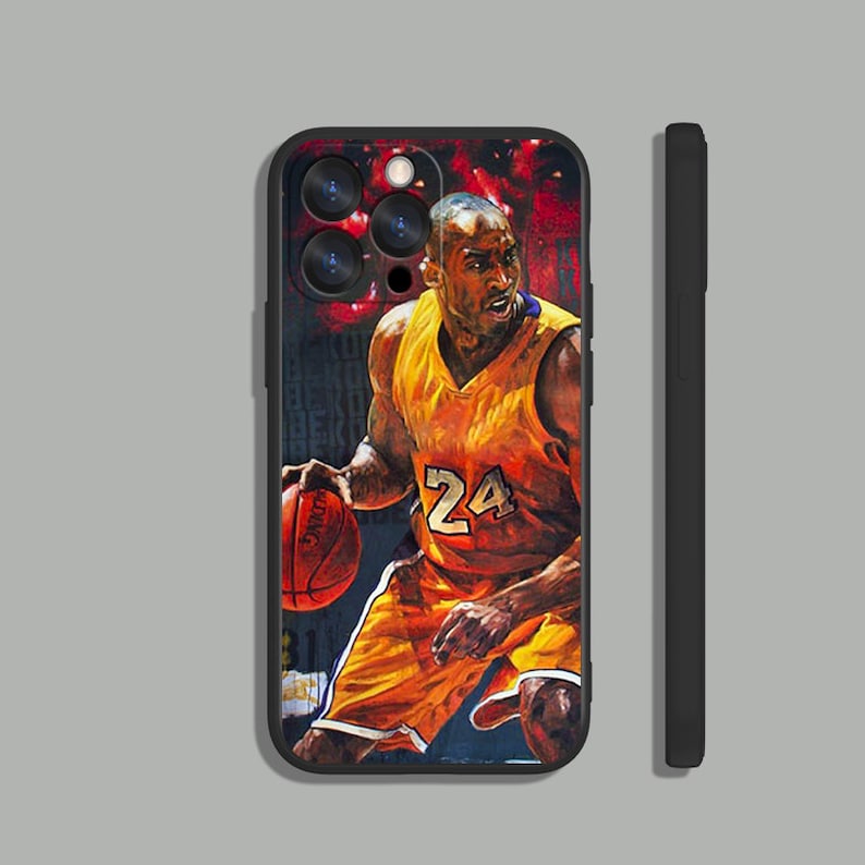 May include: Black phone case with a colorful image of a basketball player wearing a yellow jersey with the number 24 on it. The player is dribbling a basketball.