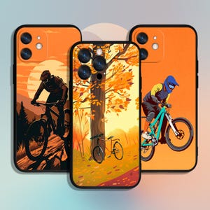 May include: Three phone cases with different designs. The first case features a silhouette of a person riding a mountain bike on a trail with a sunset in the background. The second case features a colorful autumn tree with fallen leaves. The third case features a person riding a mountain bike on a trail with a sunset in the background.