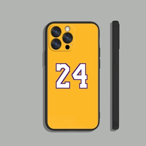 May include: Yellow iPhone case with a black camera bump and a white number "24" printed on the back.
