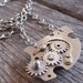 A CLOCKWORK NECKLACE vintage alarm clock parts necklace