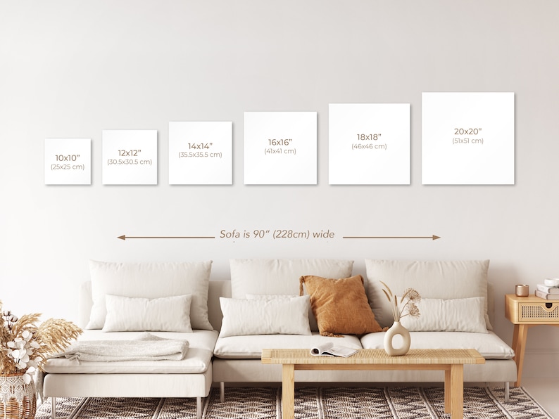 May include: A white sofa with brown throw pillows sits in front of a white wall with five different sized square canvases. The canvases are labeled with their dimensions in inches and centimeters. The text "Sofa is 90" (228cm) wide" is written below the canvases.