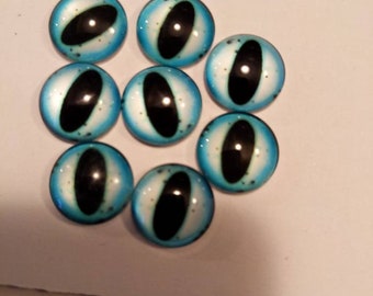 One pair of glass eyes blue colour  various sizes