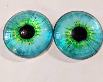 One pair of glass cabachon eyes greeny/blue colour 30mm