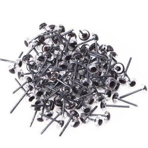 May include: A large pile of black and clear plastic safety eyes with metal posts. The eyes are used for crafts and sewing projects.