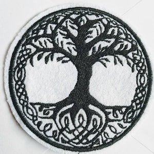 May include: A black and white embroidered patch depicting a tree of life with intricate roots and branches. The tree is surrounded by a Celtic knot design.