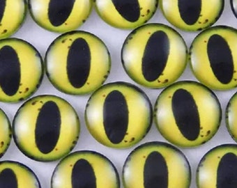 One pair of glass eyes yellow colour  various sizes