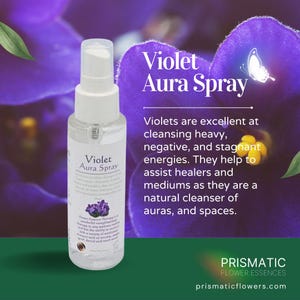 May include: A clear plastic spray bottle labeled Violet Aura Spray with a white pump top. The label features text about cleansing negative energies and a small image of violet flowers. The background displays large, vibrant purple violet petals.