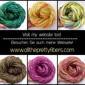 May include: Six skeins of hand-dyed yarn in various color combinations, including green and blue, yellow and orange, pink and purple, and brown and green. The yarn is arranged in a circle and is ready to be used for knitting or crocheting.