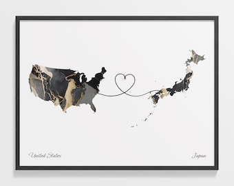 May include: A black and white map of the United States and Japan connected by a line with a heart in the middle. The text "United States" and "Japan" are below the maps.